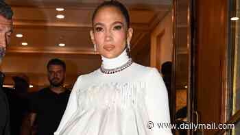 Jennifer Lopez, 56, oozes glamour in a sculptural white dress as she twirls out of her hotel in Paris