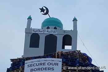 Loyalist bonfire lit early after police begin to remove mosque replica