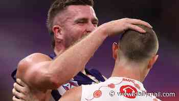 AFL's taunting rule ridiculed by fans after two players were penalised for rubbing an opponent's hair
