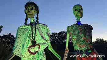 Couple with terrifying 12ft-tall SKELETONS hanging in their front yard score huge win after being ordered to take them down by city officials