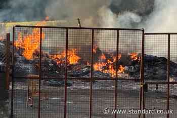 Bonfire topped with replica mosque set alight before bid to remove hate display