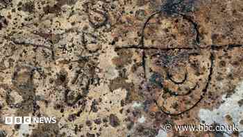 Intriguing slogan, names and cartoon found carved into WW2 defences