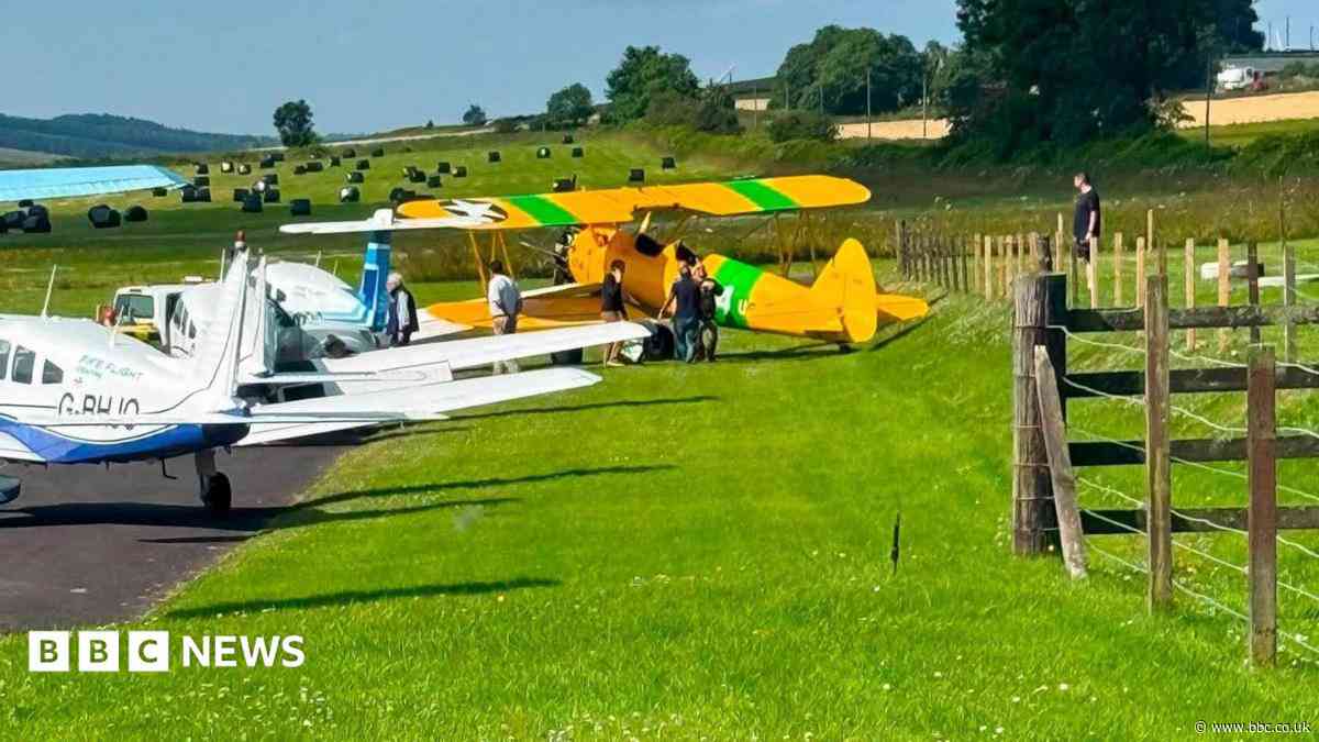 Armed police respond to plane crashing into other aircraft after skidding off runway