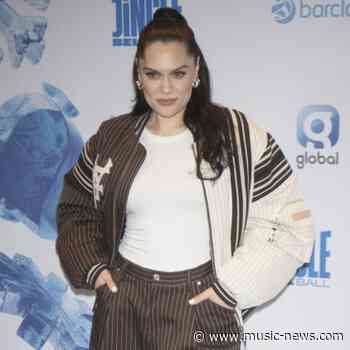 Jessie J urges women to enjoy their breasts 'while you've got them' as she accepts award