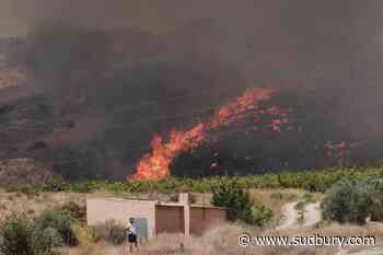One of Spain's deadliest wildfires has killed at least 12 people, with 23 others missing