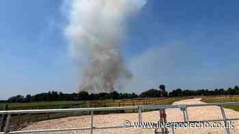 Live updates as thick black smoke plumes from fire near farm