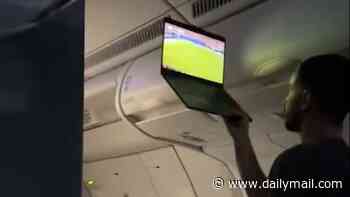 Incredible moment plane passenger holds up his laptop to live-stream Argentina's historic World Cup comeback to entire flight