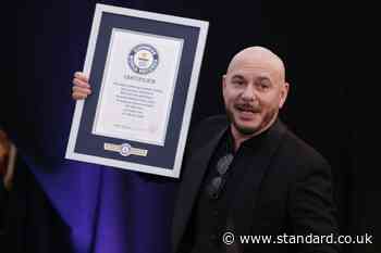 Mr World Record: Pitbull recognised for largest gathering of people in bald caps
