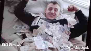 Dealer who posed with his drugs cash is jailed