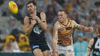 AFL LIVE: Blues fans fume after unclear umpire call gifts Ginnivan a goal as rain persists
