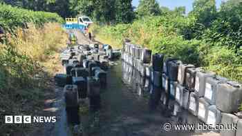 Fly-tippers dump 95-100 drums of oil on lane