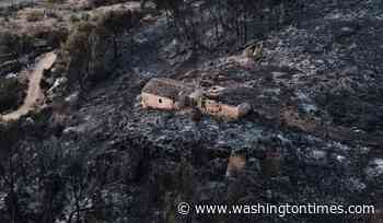 Hundreds of firefighters battle wildfire in southern Spain that killed at least 12