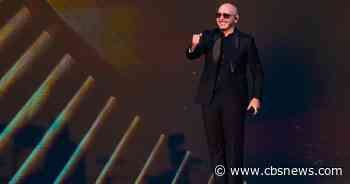Pitbull sets record for largest gathering of people wearing bald caps