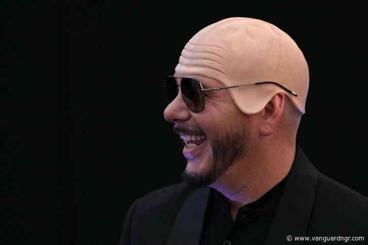 US rapper Pitbull sets bald cap world record at London show