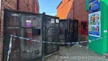 Three people arrested after alleyway cordoned off by police