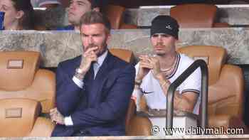 David Beckham looks tense as he is joined by his family at Miami stadium ahead of kick off for England's quarter-final World Cup game against Norway