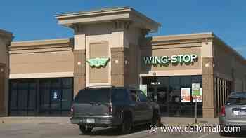 Parents leave six kids, including two INFANTS, in car on sweltering day to scarf chicken wings