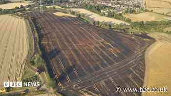 Combine harvester stone spark starts field fire