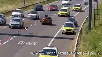 Police race to M61 as car left crushed following crash with three injured