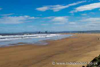Two men die after going into sea to save two children at UK beach