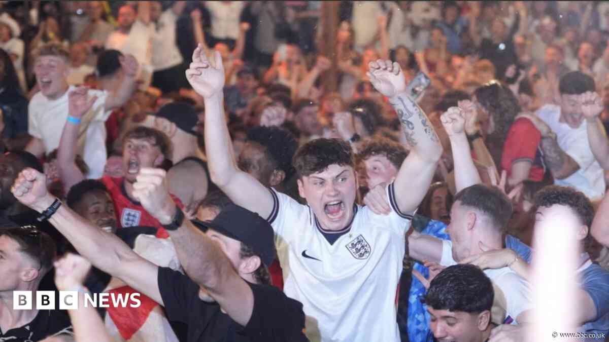 England fans in Manchester hug each other after win