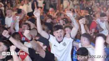 England fans in Manchester hug each other after win