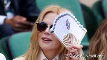 Nicole Kidman has a face of thunder as her famous pale skin is scorched by the sun at Wimbledon