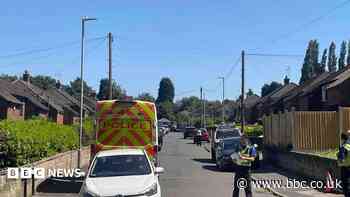 Man arrested after woman found dead in flat