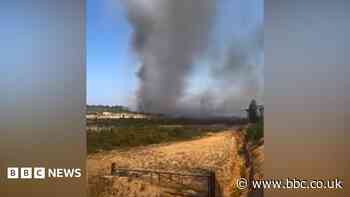 Crews still tackling hot spots at heathland fire