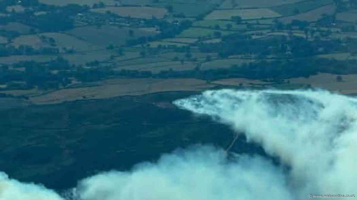Huge wildfire rages and forces residents to evacuate - live updates