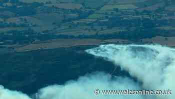 Huge wildfire rages and forces residents to evacuate - live updates