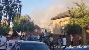 Moment huge flames engulf London railway line as heatwave raises wildfires risk with firefighters tackling infernos across Britain