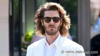 Andrew Garfield's wild long hair leaves him looking 'almost unrecognisable' at Wimbledon as he is overshadowed by Jennifer Lopez's huge hat
