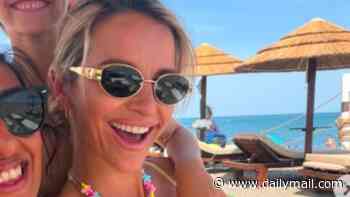 Pregnant Vogue Williams, 40, shows off her bump in a yellow bikini as she kickstarts the school summer holidays in Spain with Spencer Matthews and their kids