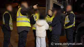 Moment two Vietnamese girls are discovered by Border Force officials after being hidden inside concealed lorry compartment