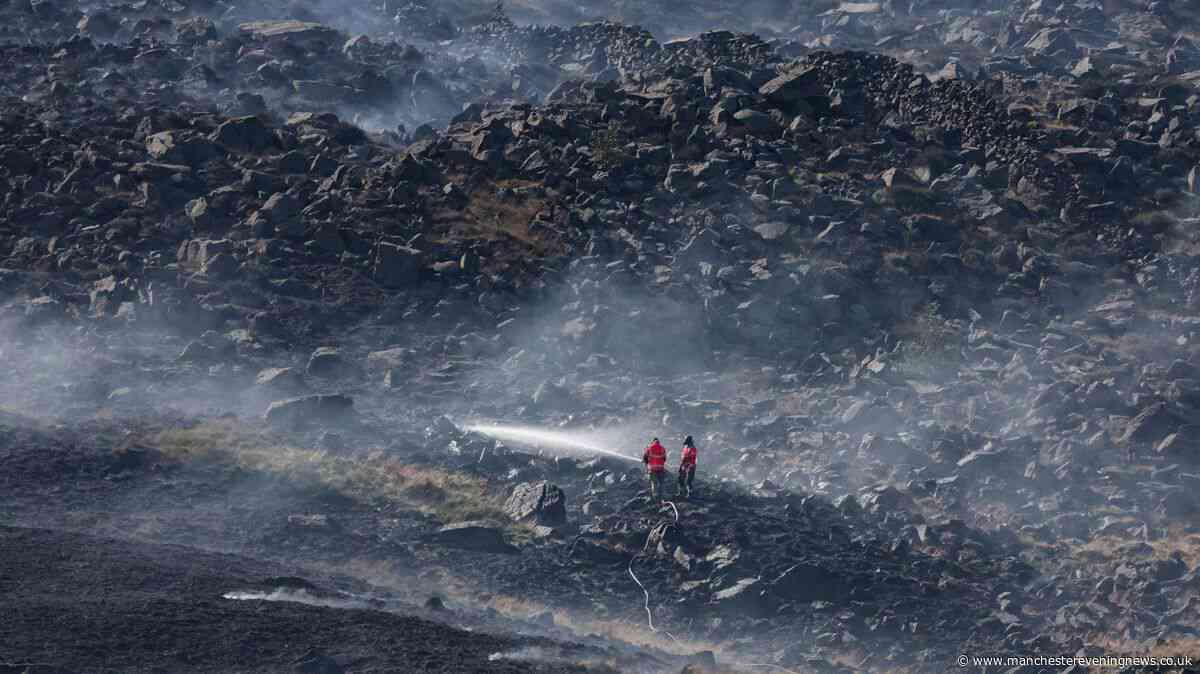 Woman, 20, arrested for arson over Dovestone wildfire as firefighters work to tackle blaze