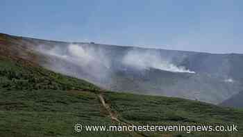 Dovestone moor fire LIVE as woman arrested and major incident declared