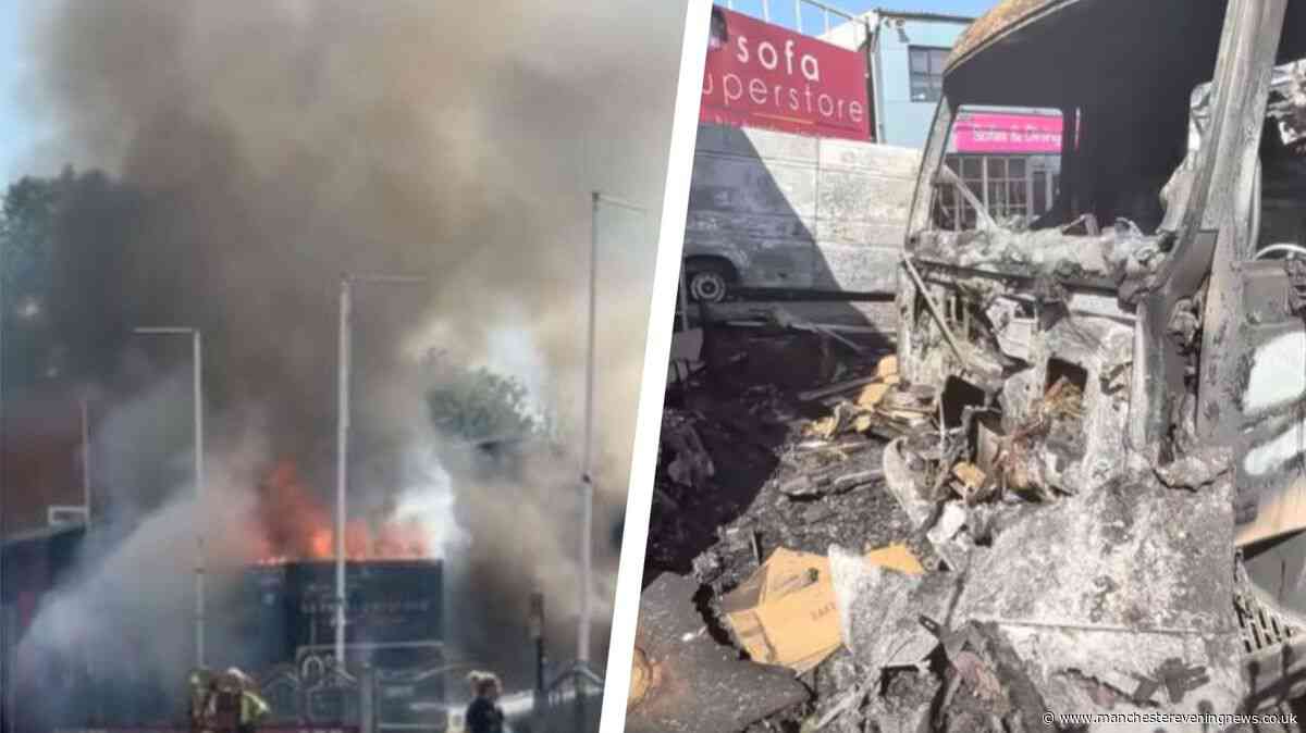 Dramatic video as lorry left scorched following huge fire outside furniture outlet in Oldham
