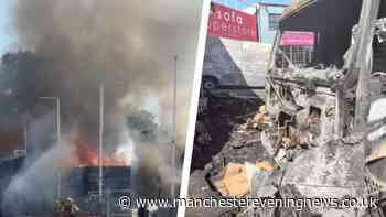 Dramatic video as lorry left scorched following huge fire outside furniture outlet in Oldham