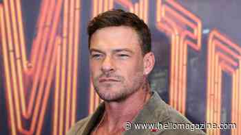 Alan Ritchson showcases ripped physique in shirtless red carpet appearance