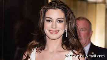 Pregnant Anne Hathaway, 43, glows in silk dress as she heads to Late Night with Seth Meyers in NY
