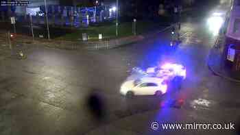 Shocking moment mum smashes into police car which burst into flames