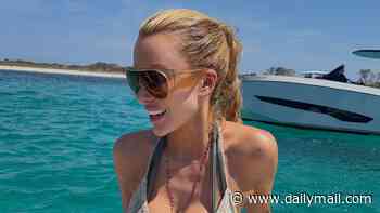 Olivia Attwood shows off her toned figure in a barely-there bikini as she soaks up the sun on a boat day in Formentera while plugging her new cocktail brand