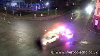 Rock Ferry mum runs red light in Birkenhead before police car set on fire