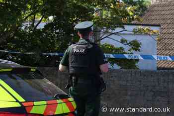 Police remain at the scene after three relatives found dead in family home