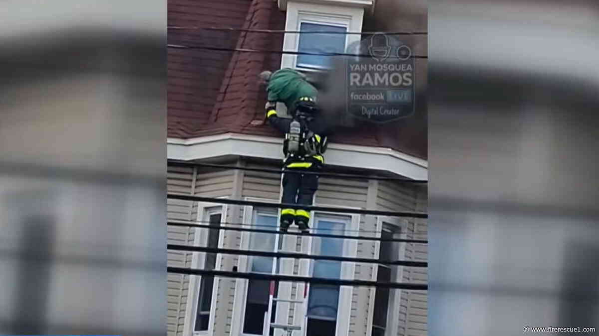 Video: Firefighter rescues man from 5-alarm Mass. fire