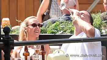 Jack Grealish slumps over a bar table as he downs champagne and splashes out on vodka on a boozy day out with female friends - while his old England team-mates prepare for historic World Cup semi-final