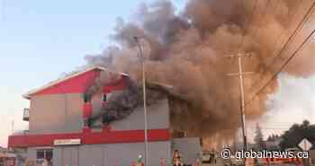 1 dead, 2 missing after vehicle hits Edmonton building, causing fiery explosion