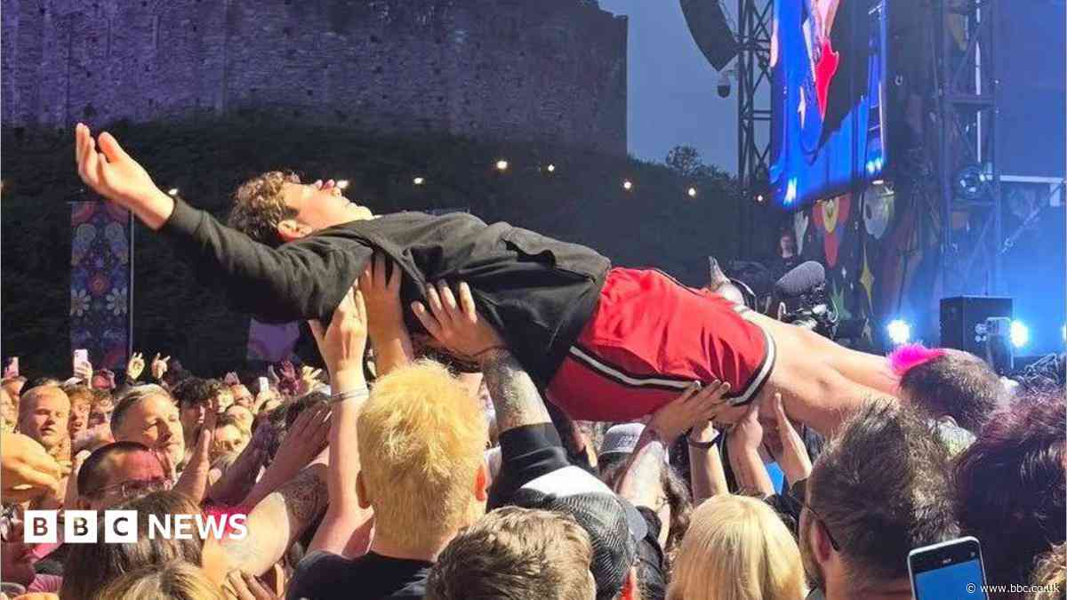 Son of rock band frontman 'fine' after falling on his head during Cardiff crowd surf