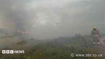 Crews spend night on heathland after wildfire